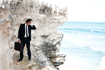 Image showing Business, briefcase and man with stress, cliff and depression with burnout, jobless and mental health. Person, employee and consultant with ocean, formal and fail with mistake, outdoor and suicide