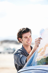 Image showing Road map, car and young man with smile for weekend trip, vacation or holiday in countryside. Happy, vehicle and male person from Canada reading for travel, transport and outdoor adventure or journey.