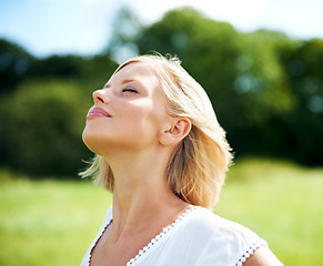 Image showing Woman, breathe and calm in nature, peace and zen for inner wellness, summer and relax. Person, mindfulness and serenity in countryside, freedom and healing for mental health, mindset and soul