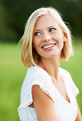 Image showing Freedom, travel and happy woman on a field for adventure, journey and enjoy a peaceful morning. Face, smile and female traveler relax in nature with good mood, cheerful or positive mindset on holiday