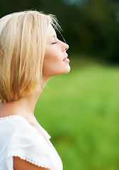 Image showing Woman, calm and breathing in nature, peace and zen for inner wellness, relax and environment. Person, mindfulness and serenity in countryside, free and healing for mental health, mindset and soul