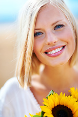 Image showing Happy woman, face and portrait smile with flowers for summer break, eco friendly or vacation in nature. Closeup of female person in happiness with plant, outdoor or petal for season change outside