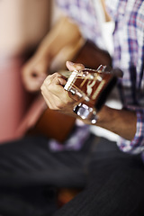 Image showing Guitar, hands or man in home for music, performance or entertainment with sound, rhythm or talent. Learning solo, artist closeup or creative musician playing an instrument for artistic expression