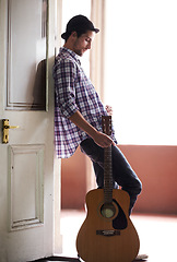 Image showing Musician, waiting and man with a guitar, instrument and singer in a music studio. Creative, artist and guitarist standing in home and thinking of performance, equipment or listening to audio of band