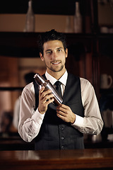 Image showing Cocktail, mixer and portrait of bartender with a drink for customer in dark club or night. Mixing, alcohol and face of barman with liquor in metal container to shake for a strong beverage in a bar