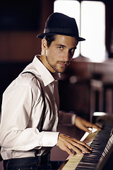 Image showing Piano, portrait or man in club for music, performance or entertainment with talent or freedom. Learning solo, pianist or creative musician playing keys on instrument or organ for artistic expression