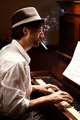 Image showing Profile, piano and man with performance, smoking and entertainment with keyboard, jazz and creative. Person, artist and musician with cigarette, tobacco and ambient with smoke, pianist and instrument