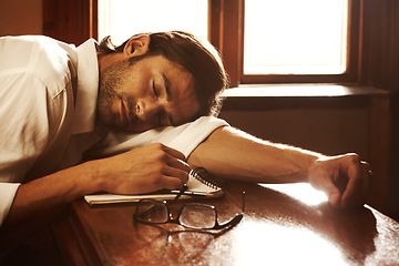 Image showing Writer, notebook and sleeping or tired of writing for journalist or media freelance career. Fatigue, exhausted and person or author with glasses and notes or sunlight on a table to nap or rest