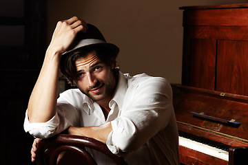 Image showing Portrait, musician and man with a piano, creative and fashion with confidence, hat and performer. Face, person and pianist with instrument, stylish outfit and clothes with jazz, smile and performance