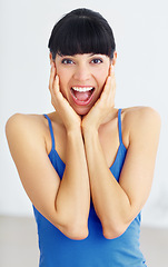 Image showing Happy, excited and portrait of woman in studio with shocked, surprised or omg facial expression. Smile, happiness and young female model with optimistic, wow or wtf face isolated by white background.