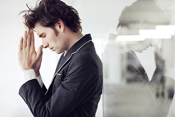 Image showing Praying, religion and young man in a studio with double exposure for gratitude, hope or worship. Trust, compassion and male model from Canada with regret or mistake isolated by white background.