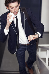 Image showing Coffee, fashion and young man by staircase with a watch checking the time for being late. Latte, walking and handsome male person with casual, formal and classy style for professional career.