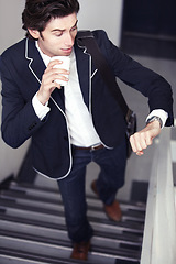 Image showing Coffee, fashion and young man by staircase with a watch checking the time for being late. Latte, walking and handsome male person with casual, formal and classy style for professional career.