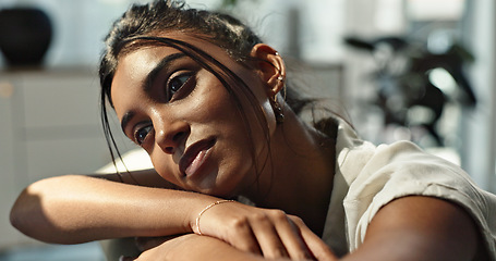 Image showing Thinking, depression and young woman on a sofa relaxing with a memory or reflection in living room. Mental health, planning and Indian female person with doubt chilling in lounge of modern apartment.