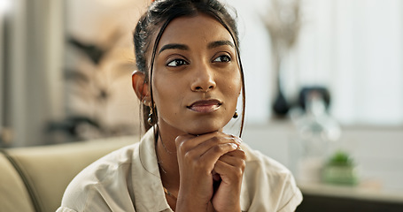 Image showing Thinking, brainstorming and young woman on a sofa relaxing with an idea or memory in living room. Reflection, doubt and nervous Indian female person with decision in the lounge of modern apartment.