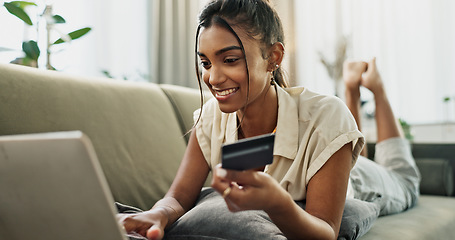 Image showing Credit Card, home laptop and happy woman online shopping, relax and check bank account balance, web store or budget. Digital money exchange, financial payment and customer buying on living room sofa