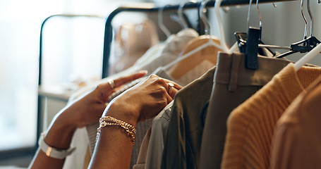 Image showing Hands of designer, clothes rail or choice in studio, workshop or small business for sample, show or collection. Creative woman, closeup or decision for design, fabric or clothing fashion in store