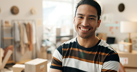 Image showing Portrait, happy and a designer man in his workshop for supply chain logistics, shipping or delivery. Face, smile and a young creative employee in a small business office for distribution or import