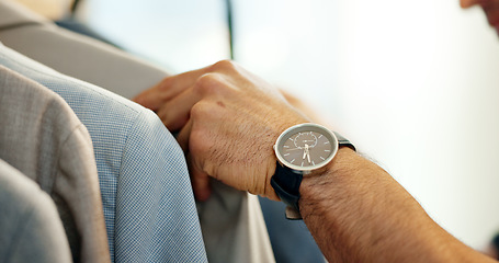 Image showing Hands of man, clothing rack or choice in small business for sample, tailor or collection in retail store. Shopper closeup, discount sale or decision for blazer design, suit fabric or fashion clothes