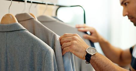 Image showing Hands of man, clothing rack or choice in store for sample, tailor or collection in small business. Creative stylist, search or designer with decision for blazer design, suit fabric or fashion clothes