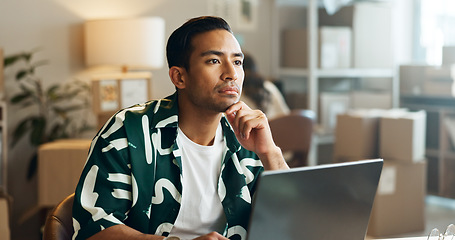 Image showing Shipping, man and thinking with laptop in office for research, feedback and supply chain for business. Asian, person and idea with pc for logistics, stock administration or package distribution data