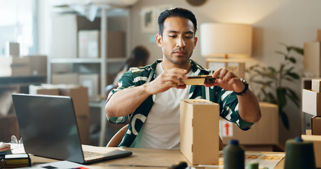 Image showing Asian man, phone and box in logistics or small business for inventory inspection or pricing for ecommerce. Male person or store owner with mobile smartphone, laptop and boxes for picture scan