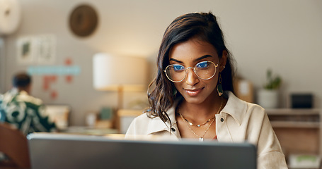 Image showing Business, woman and reading on laptop in office for research, feedback and supply chain for business. Indian, person and typing on pc for logistics, stock administration or package distribution data