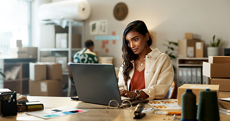 Image showing Fashion, woman and reading on laptop in office for research, feedback and supply chain for business. Indian, person and planning on pc for logistics, stock administration or package distribution data