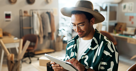 Image showing Man, typing and tablet in small business for fashion, shipping and planning supply chan schedule. Reading, reviews or employee update online shopping app in workshop with retail inventory checklist