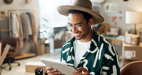 Image showing Man, typing and tablet in small business for fashion, shipping and planning supply chan schedule. Reading, reviews or employee update online shopping app in workshop with inventory or checklist