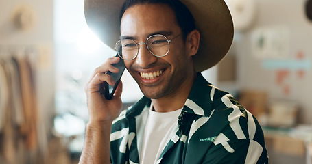 Image showing Smile, talking and man on phone call in retail for networking, orders and planning stock. Happy, thinking and an Asian employee in fashion with conversation about a sale at a boutique or shop online