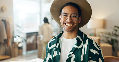 Image showing Creative, ecommerce and portrait of a man in retail for store management, fashion or designer work. Smile, happy and an Asian employee at a distribution shop for clothes, sale or logistics of stock