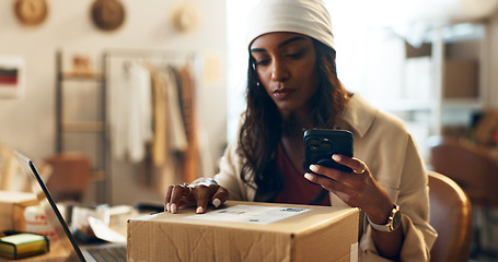 Image showing Woman, box and phone in logistics for inventory or storage inspection at fashion or clothing boutique. Female person or small business owner checking boxes for pricing with mobile smartphone at store