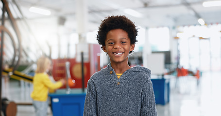 Image showing Portrait, boy and child with education for science, convention or exhibition with smile and confidence. Face, student and kid with happiness at scientific tradeshow, workshop or academy for knowledge