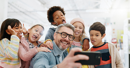 Image showing Selfie, children and teacher with funny face, smile and picture with educator, excited and happy. Kids, internet and cellphone for technology, online and memories for school, classroom or diversity