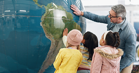 Image showing Science, world and students learning about the earth with a teacher at school for growth or development. Geography, globe or planet with a man teaching kids about climate change or global warming