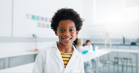 Image showing Portrait, science and child in classroom with lab coat, knowledge or learning about chemistry with smile. Face, student or boy with happiness in laboratory, workshop or academy for education or study