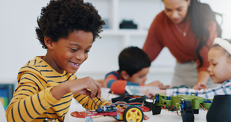 Image showing Technology, boy and car robotics in classroom for learning, education or electronics with car toys for innovation. School kids, learners and transportation knowledge in science class for research