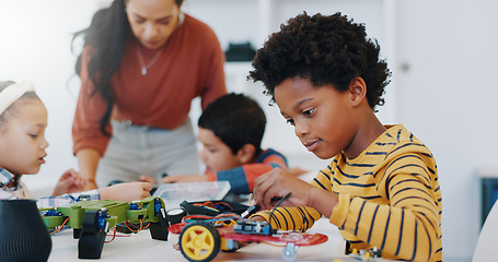 Image showing Technology, boy and car robotics at school for learning, education or electronics with car toys for innovation. Classroom, learners and transportation knowledge in science class for research or study