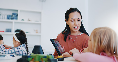 Image showing Science, tablet and teacher with child in classroom for research on a project in school. Knowledge, education and woman educator or tutor helping girl kid student on digital technology for chemistry.