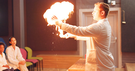 Image showing Chemistry, students and fire experiment with teacher for development, innovation and knowledge in hall. Science, children or flame for chemical research, learning and teaching at school or exhibition