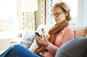 Image showing House, phone or mature woman on social media with internet connection or website notification on sofa. Glasses, search or senior person texting on networking mobile app chat or reading news to relax