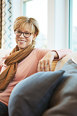 Image showing Portrait, senior or happy woman on couch to relax with calm on living room sofa at home. Apartment, glasses or mature lady with smile, peace or wellness in retirement, lounge or house for resting