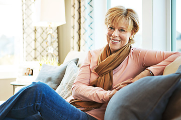Image showing Portrait, happy or mature woman on couch to relax with freedom on living room sofa at home. or senior person with smile, peace or wellness in retirement, lounge or house for resting