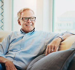 Image showing Thinking, senior man and relax on the sofa of home in the morning during retirement break. Smile, calm and an elderly person on the iving room sofa for a happy, idea or enjoying free time on weekend