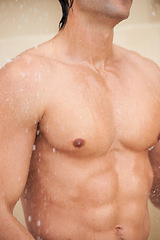 Image showing Shower, body and man with water for cleaning, washing and grooming for healthy skin. Beauty, spa treatment and torso of person with splash for hygiene, wellness and skincare hydration and cleanse