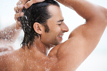 Image showing Shower, happy and man with water for cleaning, washing hair and grooming for healthy skin. Beauty, spa treatment and person smile with splash for hygiene, wellness and skincare hydration and cleanse
