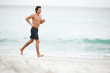 Image showing Man, music and running on beach training workout, cardio playlist or summer sport exercise. Male person, streaming listening and fitness at sea or headphones speed performance, healthy body or audio