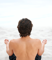 Image showing Man, lotus and beach back view on sand for meditation, zen peace or spiritual practice. Male person, fingers and ocean for holistic balance or growth reflection, mind thinking chakra or calm healing