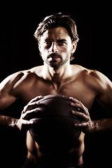 Image showing Muscle, strong and portrait of man with basketball in studio isolated on black background. Sports, serious face and athlete with ball, body abs or workout, fitness or training to exercise for health